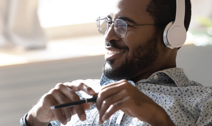 Recruiter smiling while wearing headphones