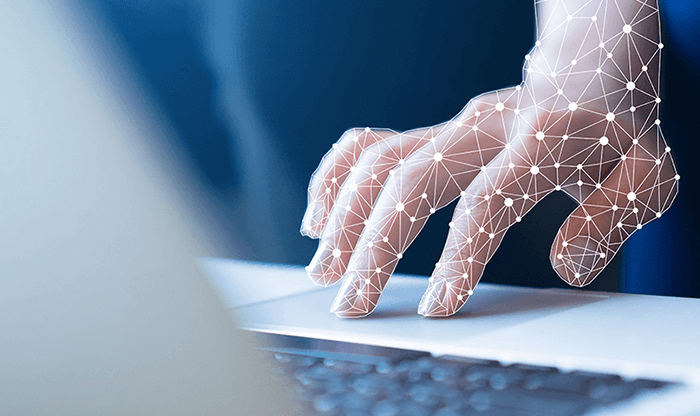 Close-up of a hand scrolling a mouse pad using iCIMS' AI recruiting automation