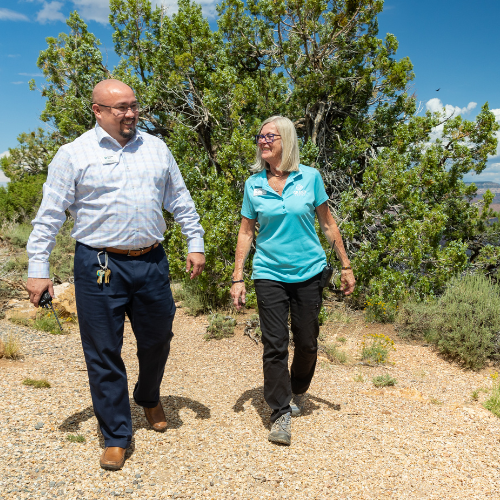 Delaware North employees walk on a gravel path