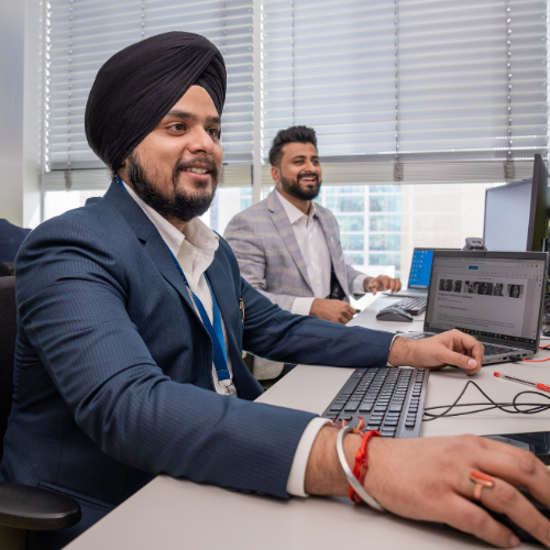 KEO employees working at their desks
