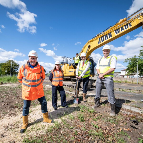 Vistry Group employees break ground on a new construction site