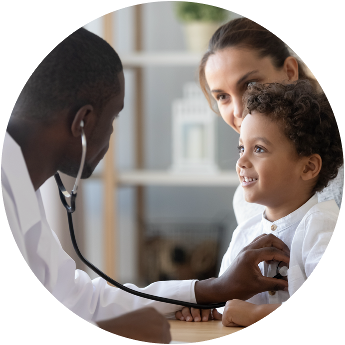 Pediatrician listening to child's heartbeat with stethoscope