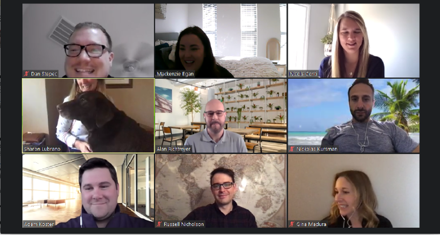 Image of 4 new employees video conferencing during remote onboarding session