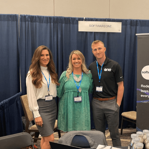 SoftwareONE employees pose for a picture at an industry event